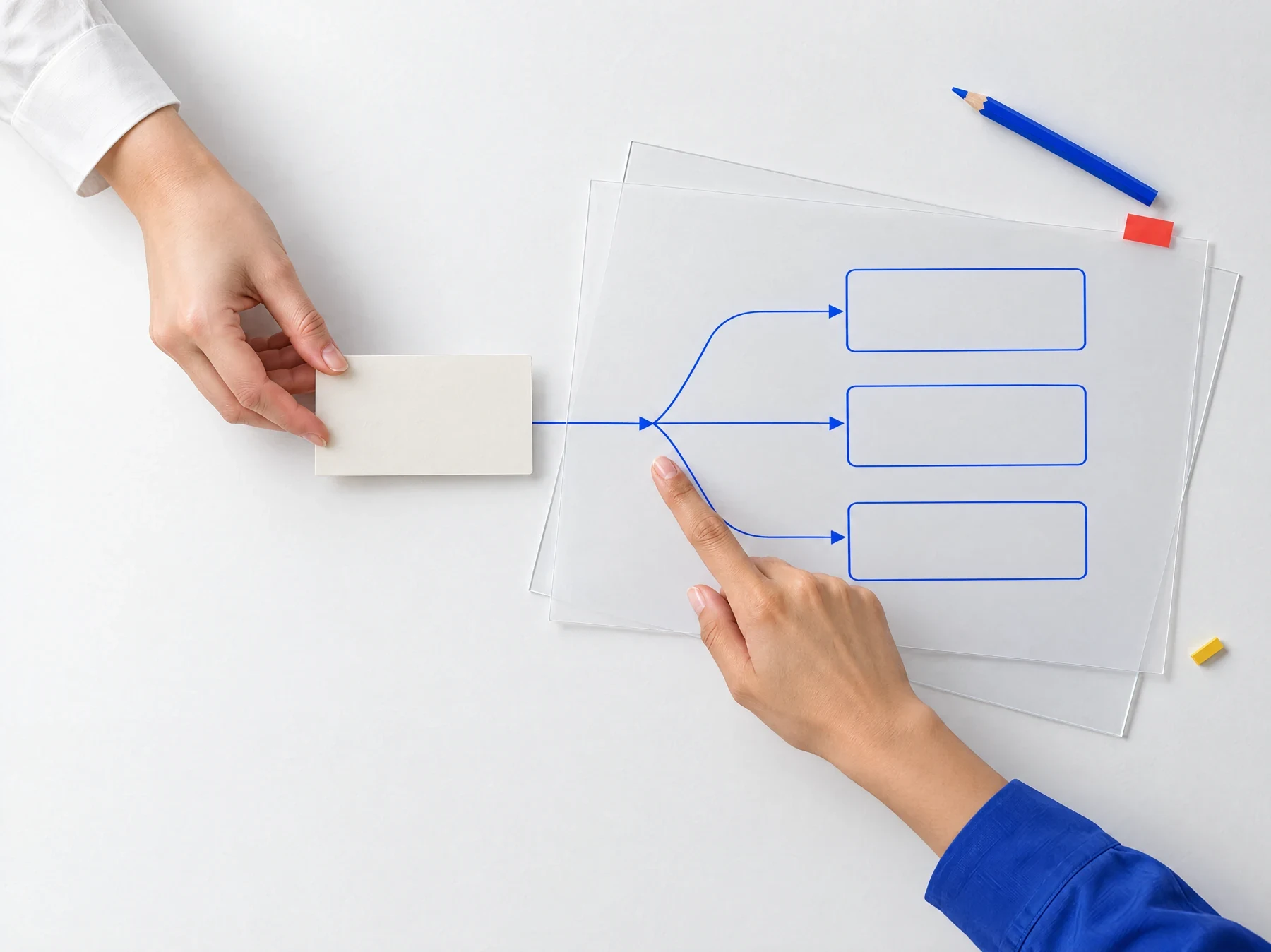 Conceptual studio photograph of two adults collaborating on an analysis task; only hands and forearms are shown.
